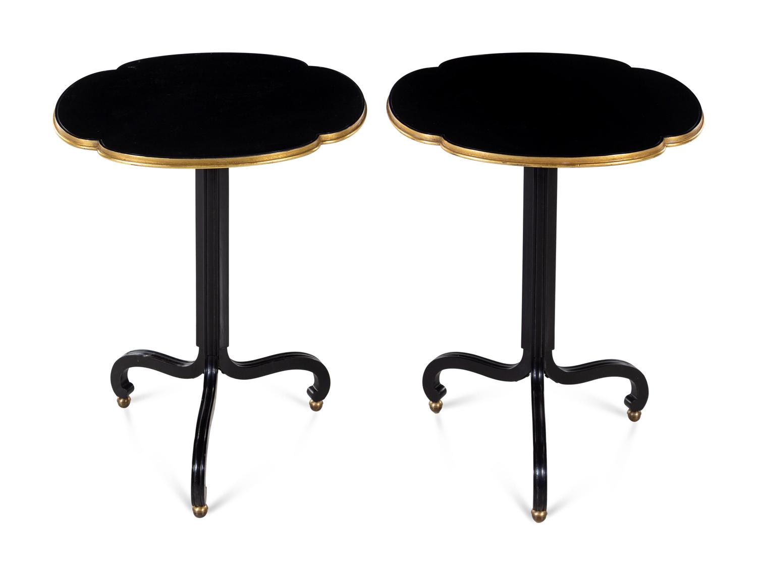 A Pair of Baker Ebonized and Parcel Gilt End Tables