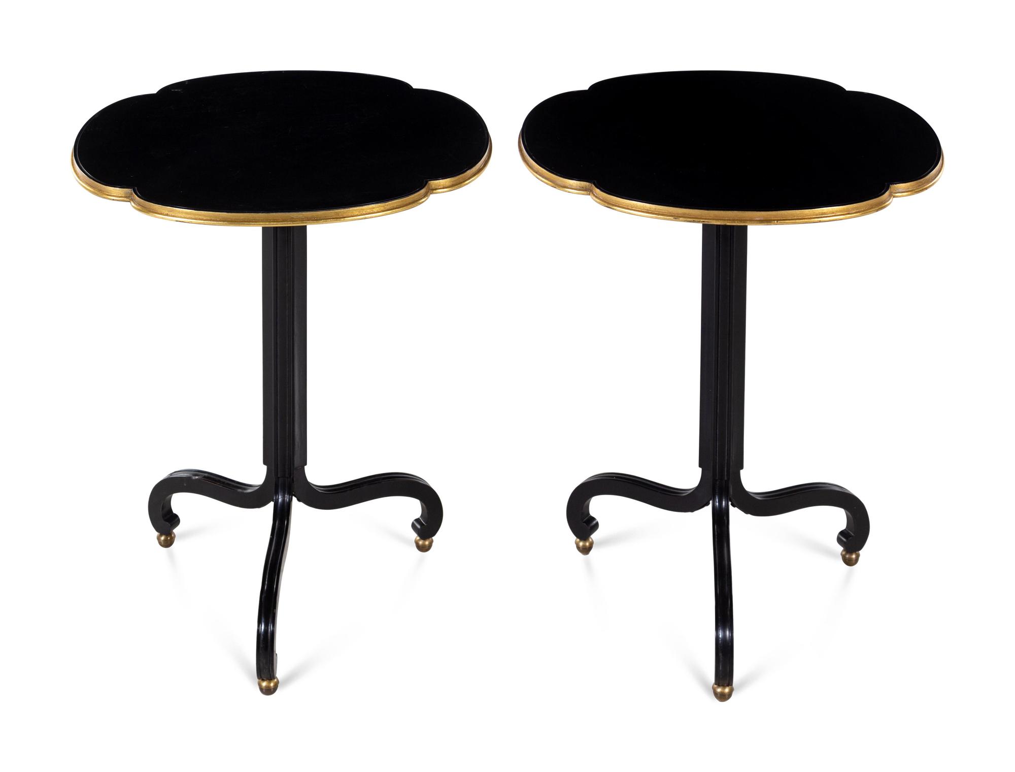 A Pair of Baker Ebonized and Parcel Gilt End Tables