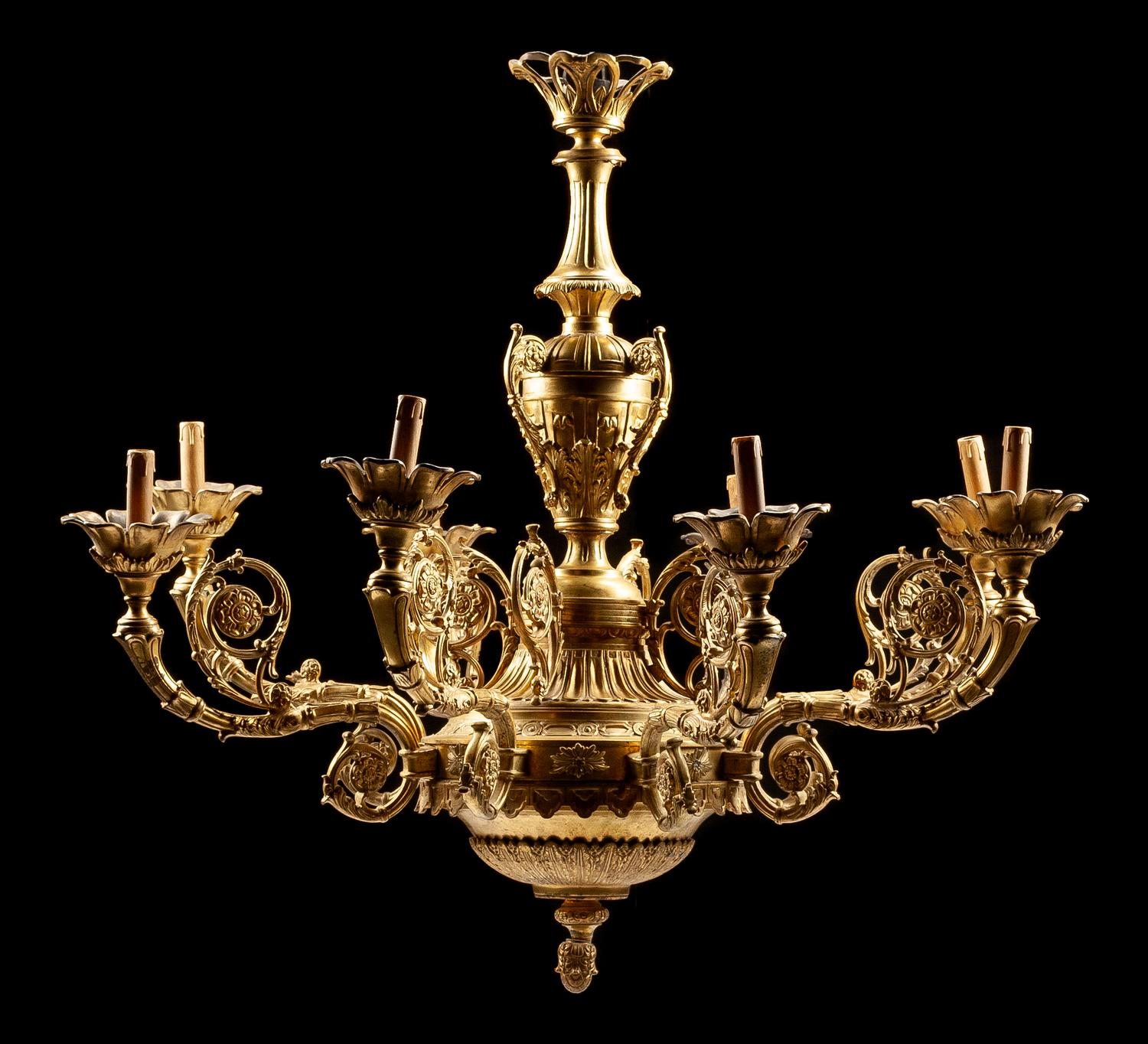 A Regence Style Gilt Bronze Eight-Light Chandelier Height 40 x diameter 44 inches.