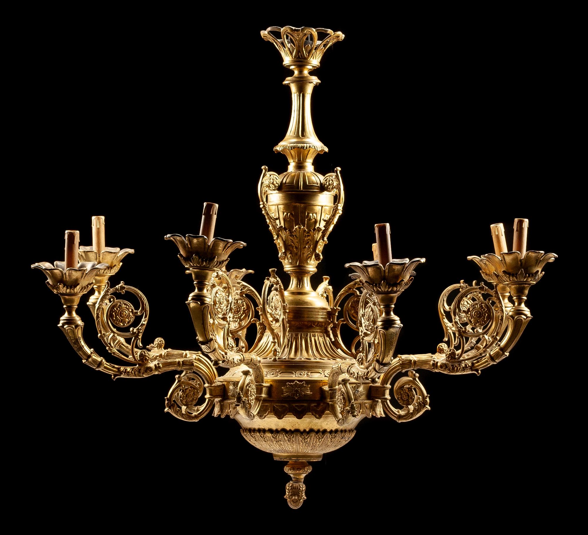 A Regence Style Gilt Bronze Eight-Light Chandelier Height 40 x diameter 44 inches.
