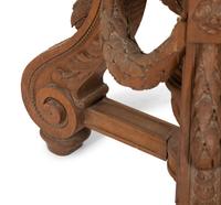 An Italian Carved Walnut Tripod Pedestal Table