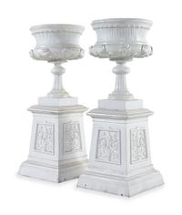 A Pair of Painted Iron Garden Urns