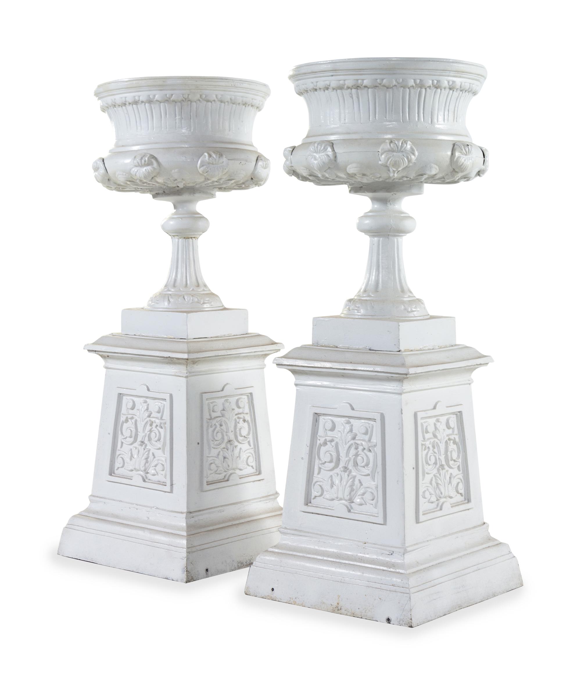 A Pair of Painted Iron Garden Urns