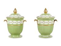 A Pair of Porcelain Covered Urns