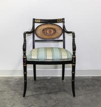 A Regency Style Ebonized Parcel-Gilt Open Armchair Height 33 3/4 inches. — 20TH CENTURY