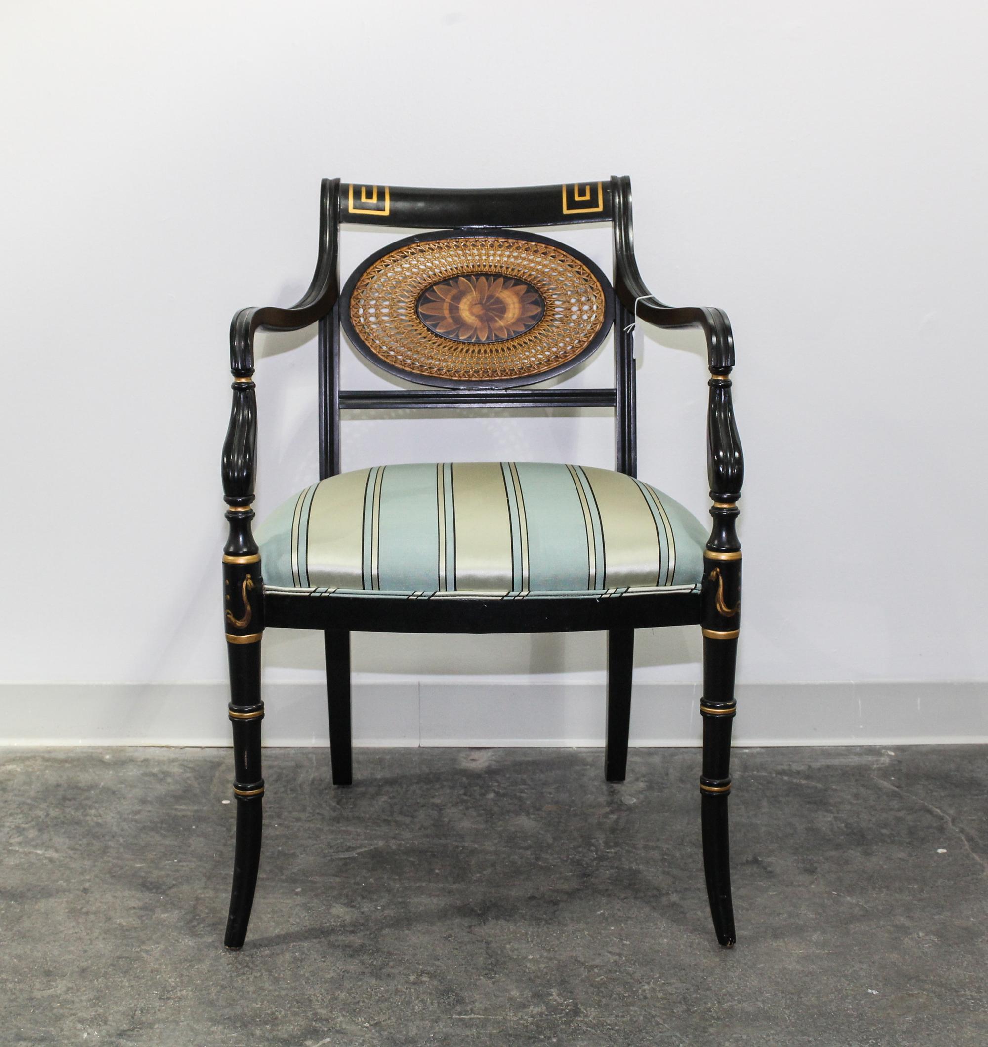 A Regency Style Ebonized Parcel-Gilt Open Armchair Height 33 3/4 inches. — 20TH CENTURY