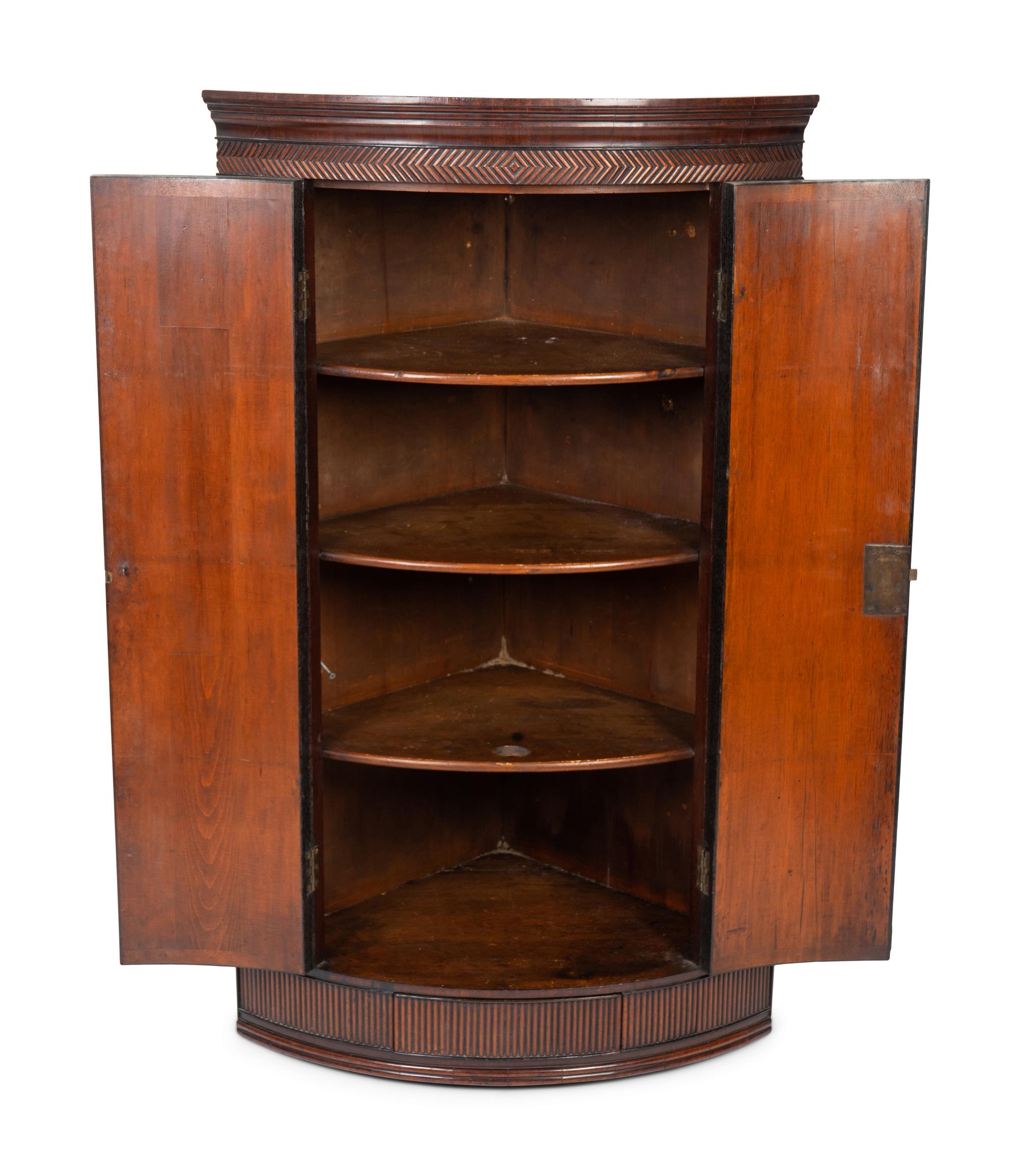 A George III Mahogany and Cross-banded Hanging Corner Cabinet — 19TH CENTURY