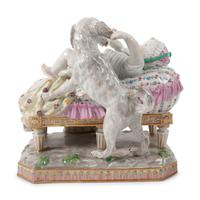 A Meissen Porcelain Figural Group of a Child in Bed with Dog