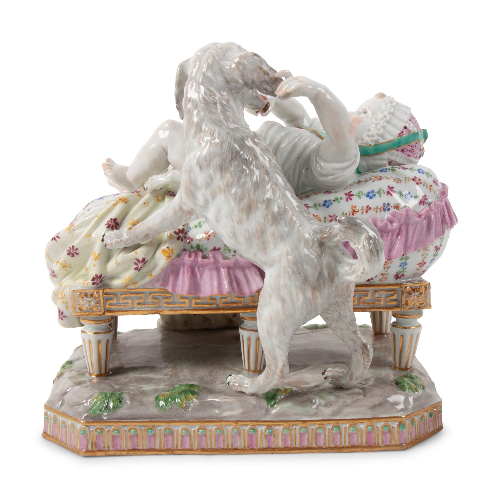 A Meissen Porcelain Figural Group of a Child in Bed with Dog