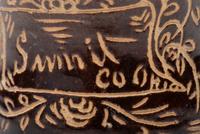A Slip-Glazed and Incised Mug
