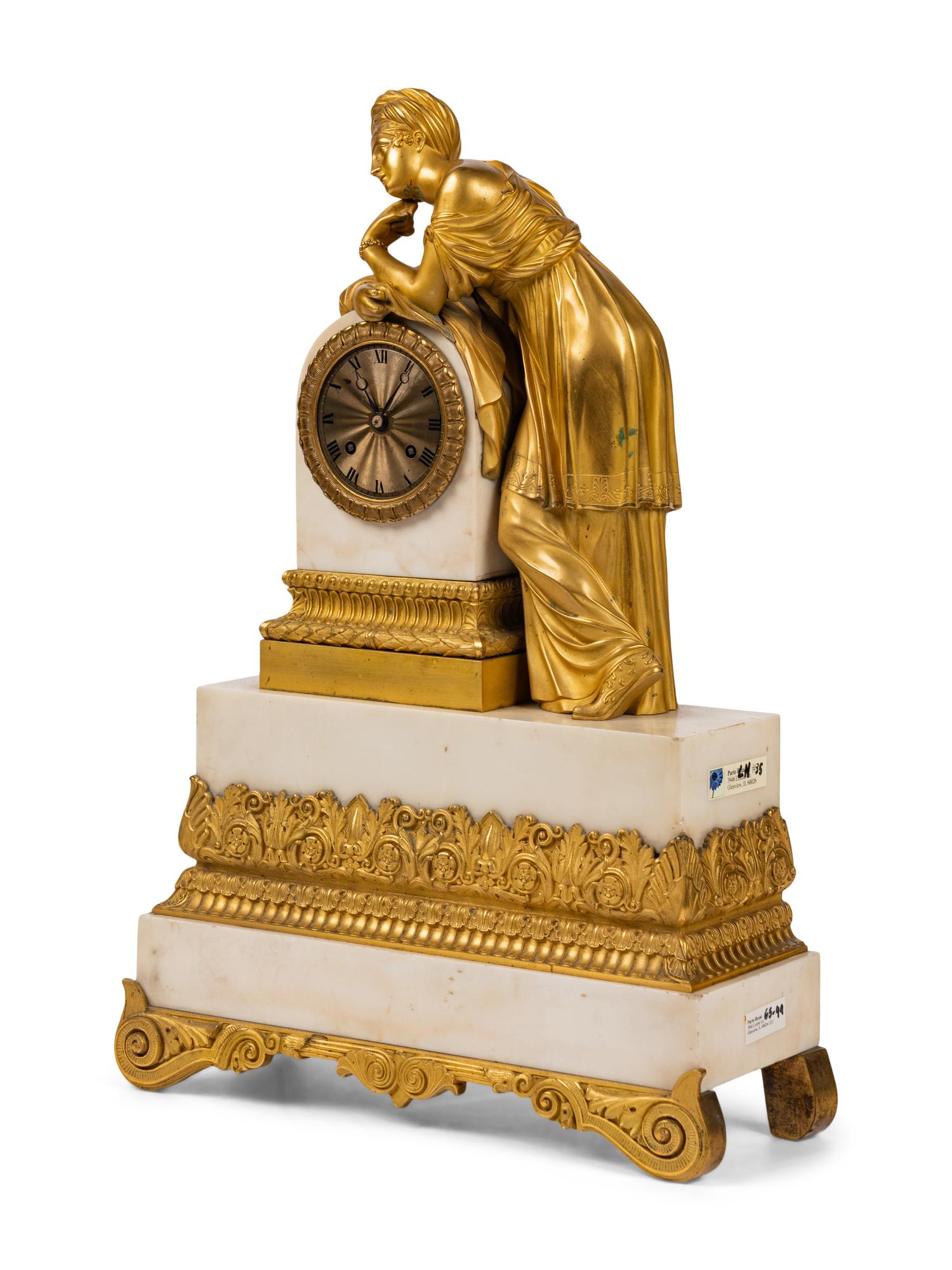 A Louis Philippe Gilt Bronze and White Marble Mantel Clock