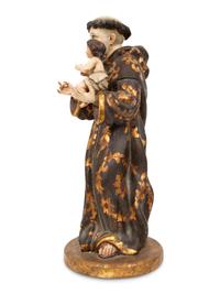 A Continental Polychrome Painted and Parcel Gilt Figure of St. Anthony of Padua