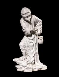 A Chinese Blanc-de-Chine Porcelain Figure of a Fisherman