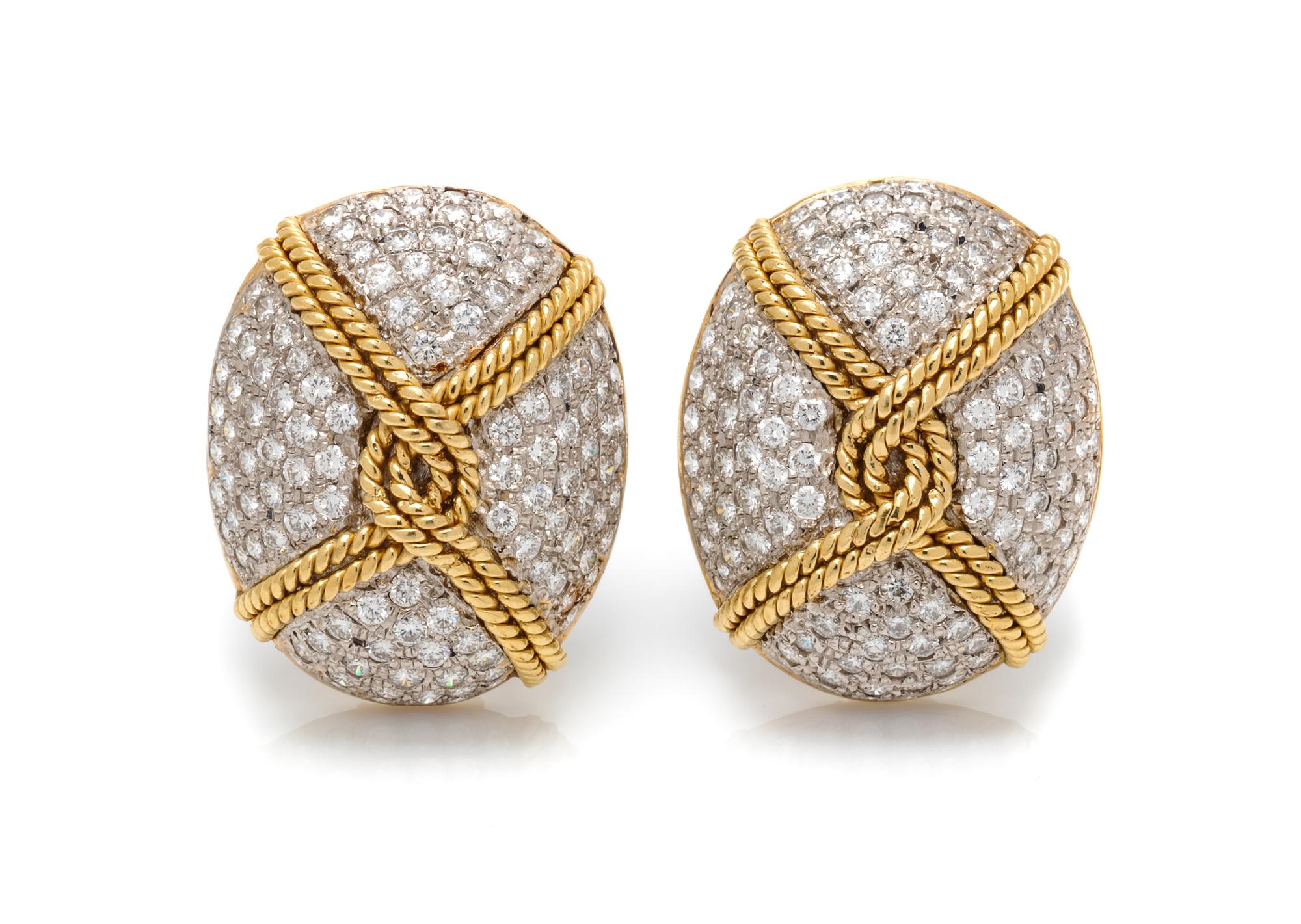 A Pair of Platinum, Yellow Gold and Diamond Earclips, 29.80 dwts.