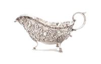 An American Silver Sauce Boat, S. KIRK & SON, BALTIMORE, MD, EARLY 20TH CENTURY, embossed and chased overall with dense flowers and fol