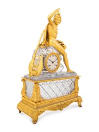 An Empire Style Gilt Bronze and Cut Glass Figural Mantel Clock