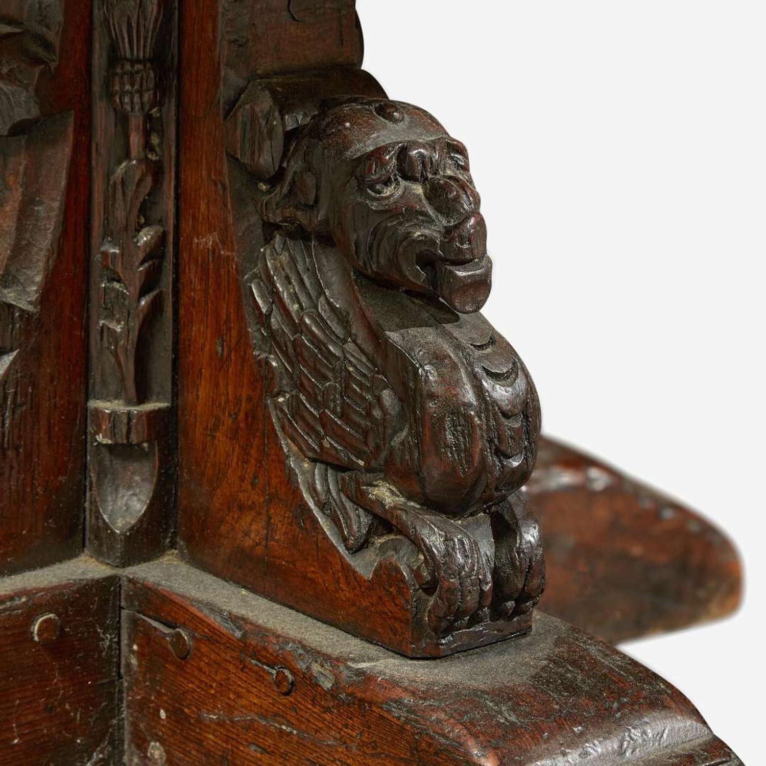 A Gothic Revival carved oak dining table composed of elements likely dating to the 17th century and later