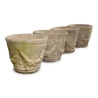 A Set of Four Cast Stone Jardinières
