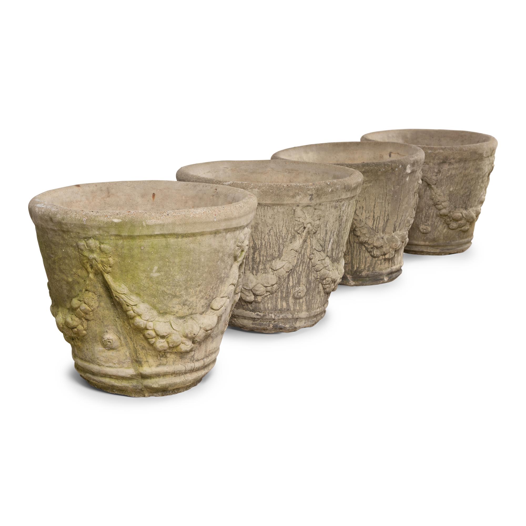 A Set of Four Cast Stone Jardinières