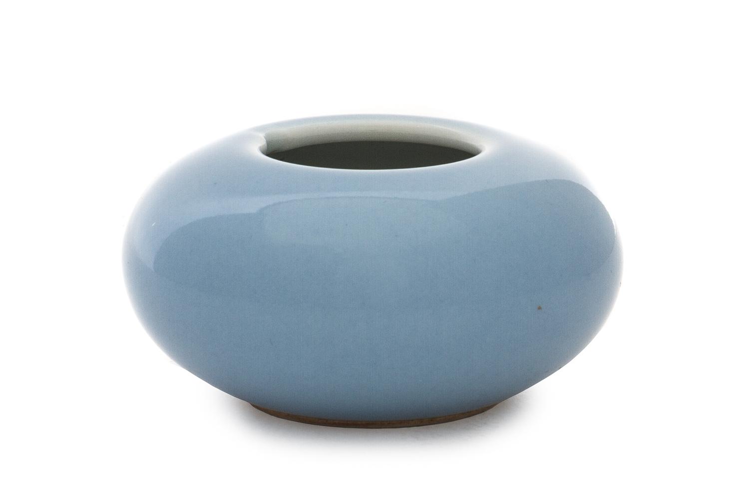 A Clair-de-Lune Porcelain Water Dropper Height 1 3/8 x diameter overall 2 3/4 inches.