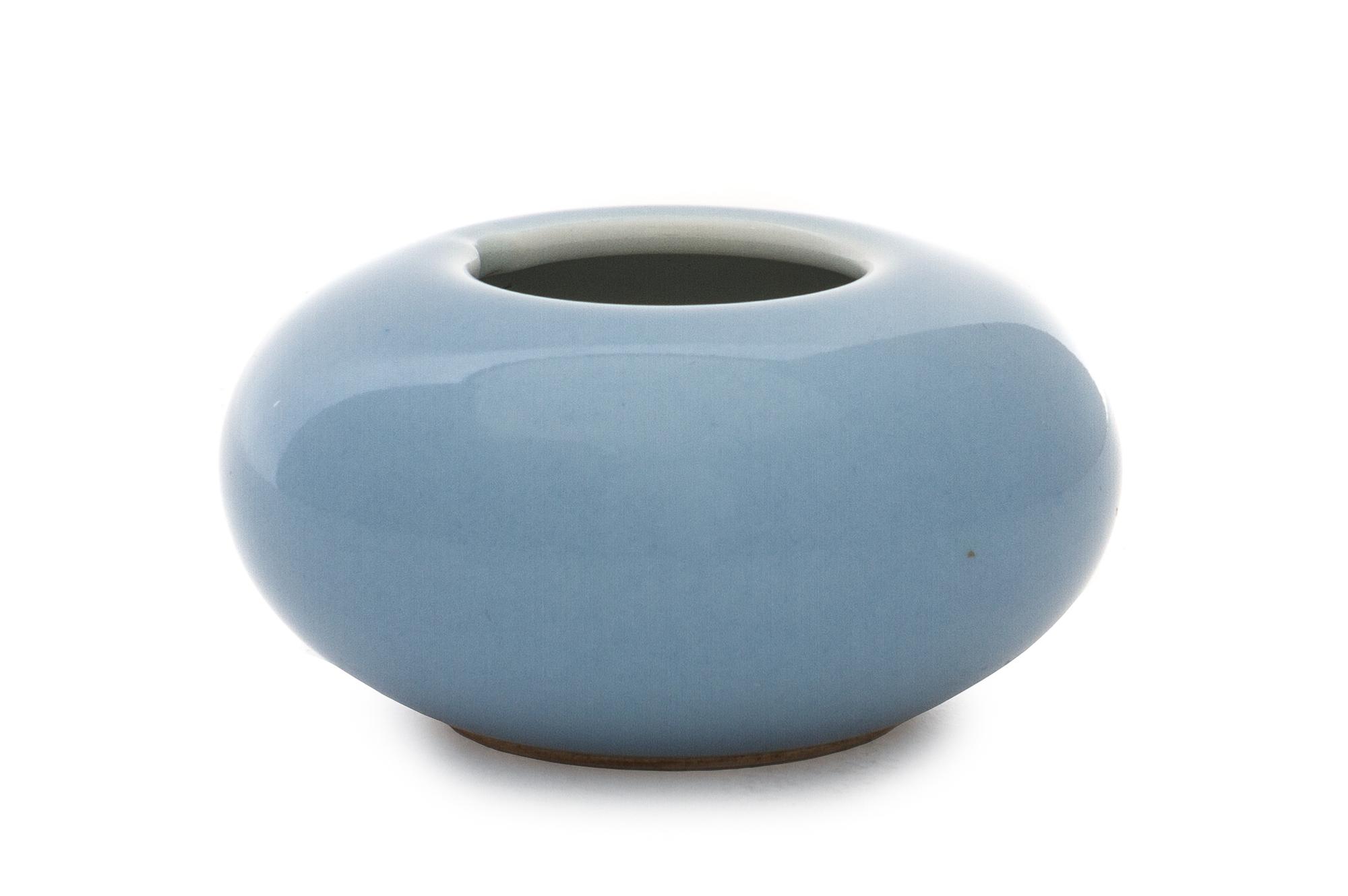 A Clair-de-Lune Porcelain Water Dropper Height 1 3/8 x diameter overall 2 3/4 inches.