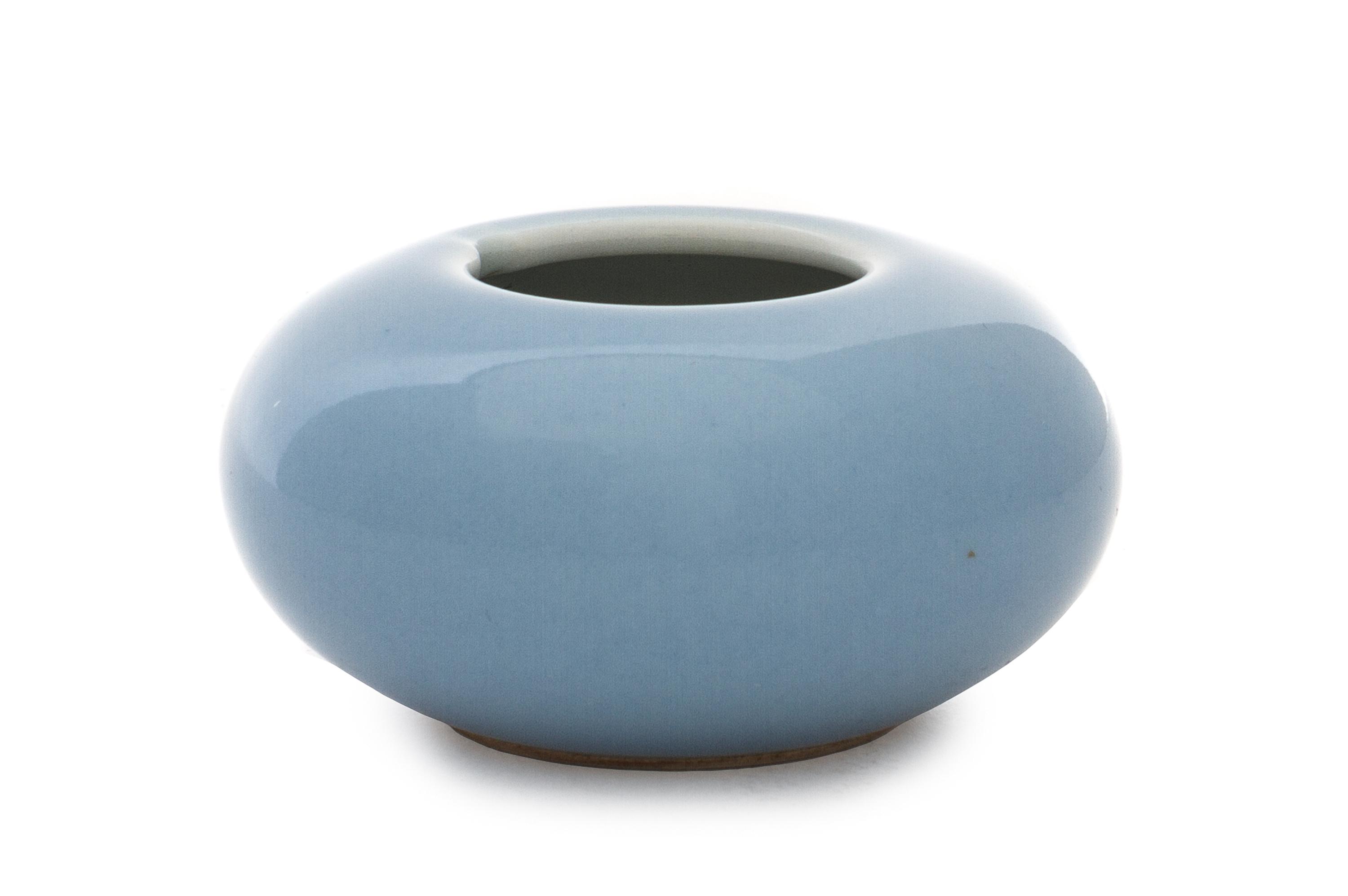 A Clair-de-Lune Porcelain Water Dropper Height 1 3/8 x diameter overall 2 3/4 inches.