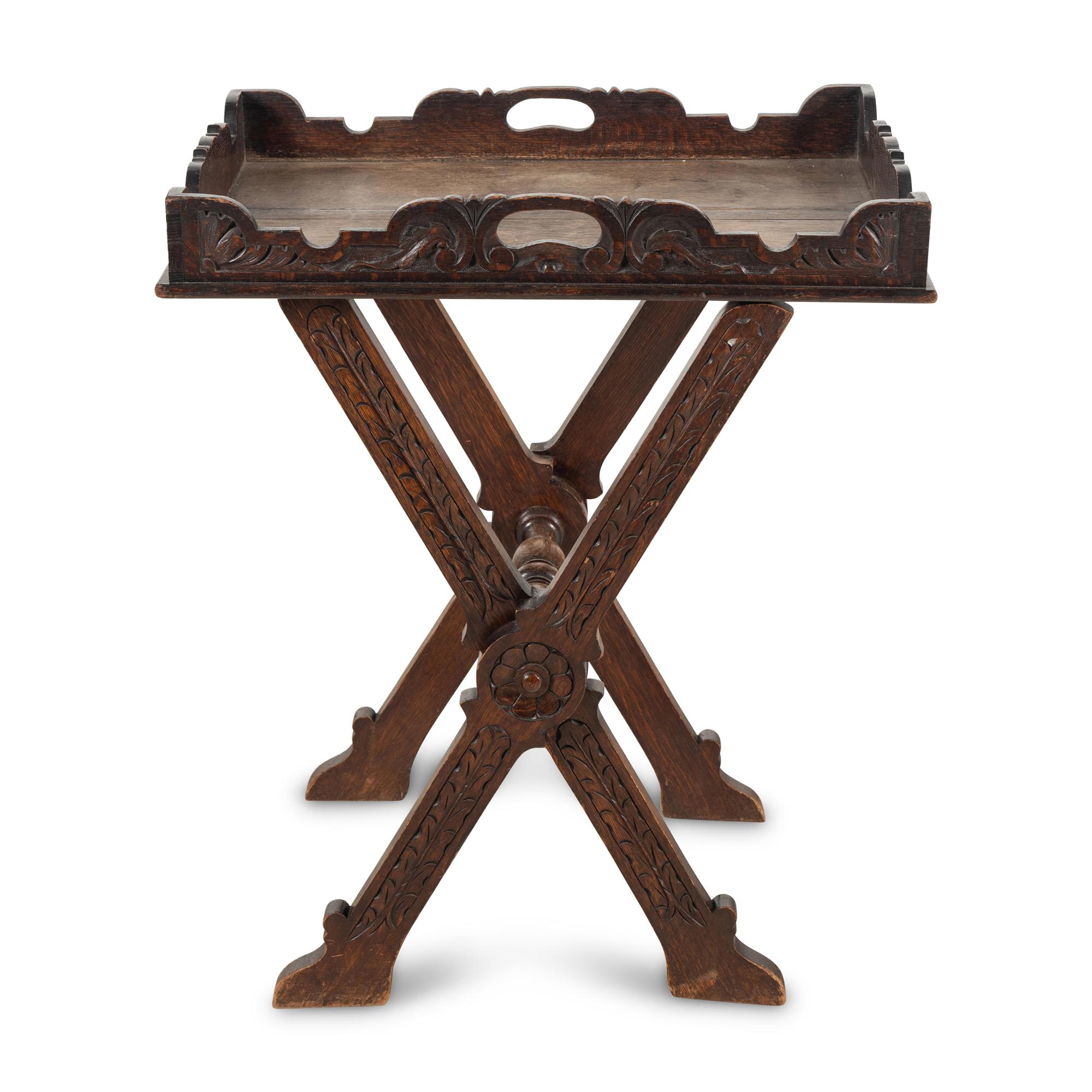 An Italian Carved Oak Butler's Tray and Stand
