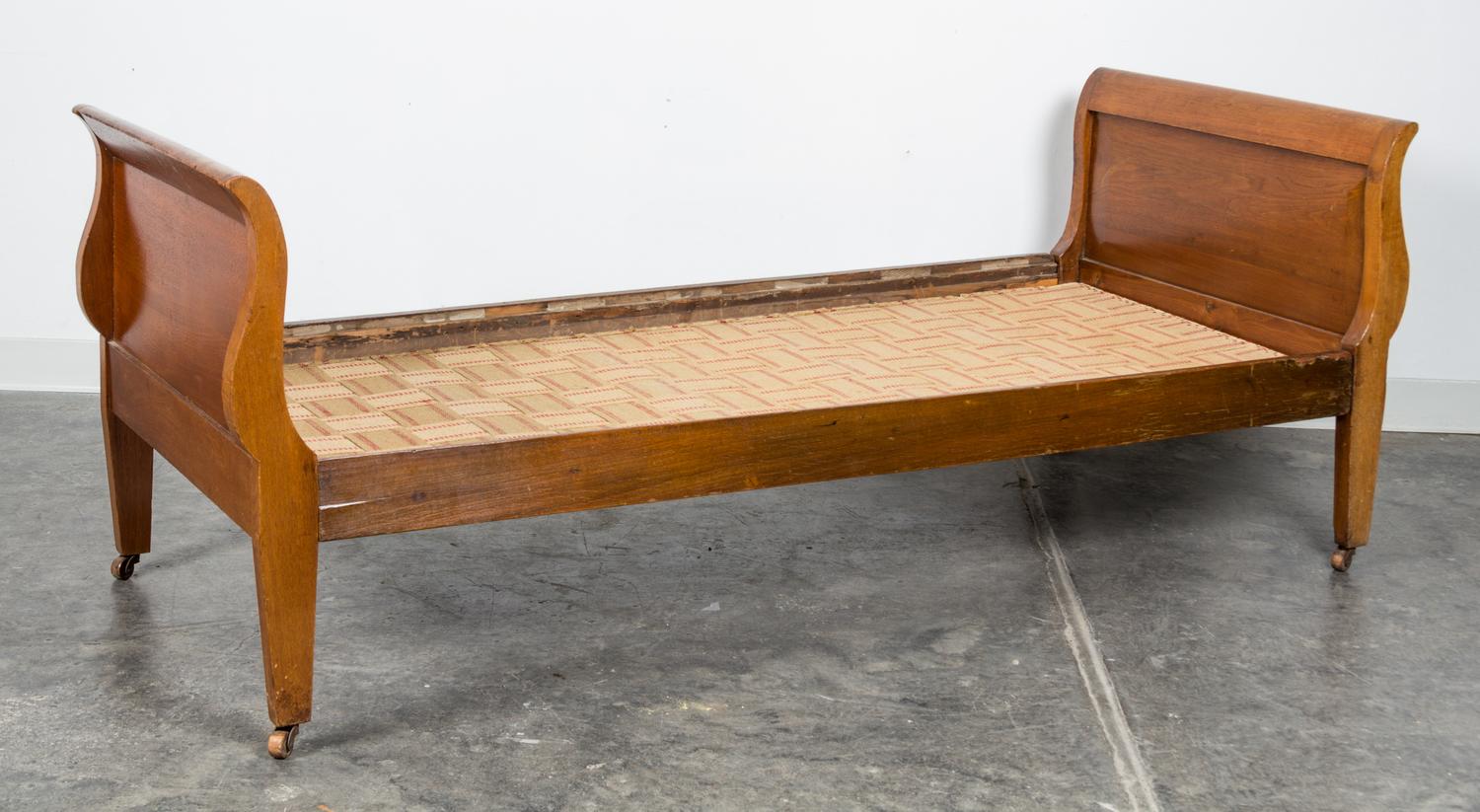 A Walnut Day Bed Height 27 1/2 x length 72 x depth 29 3/4 inches.