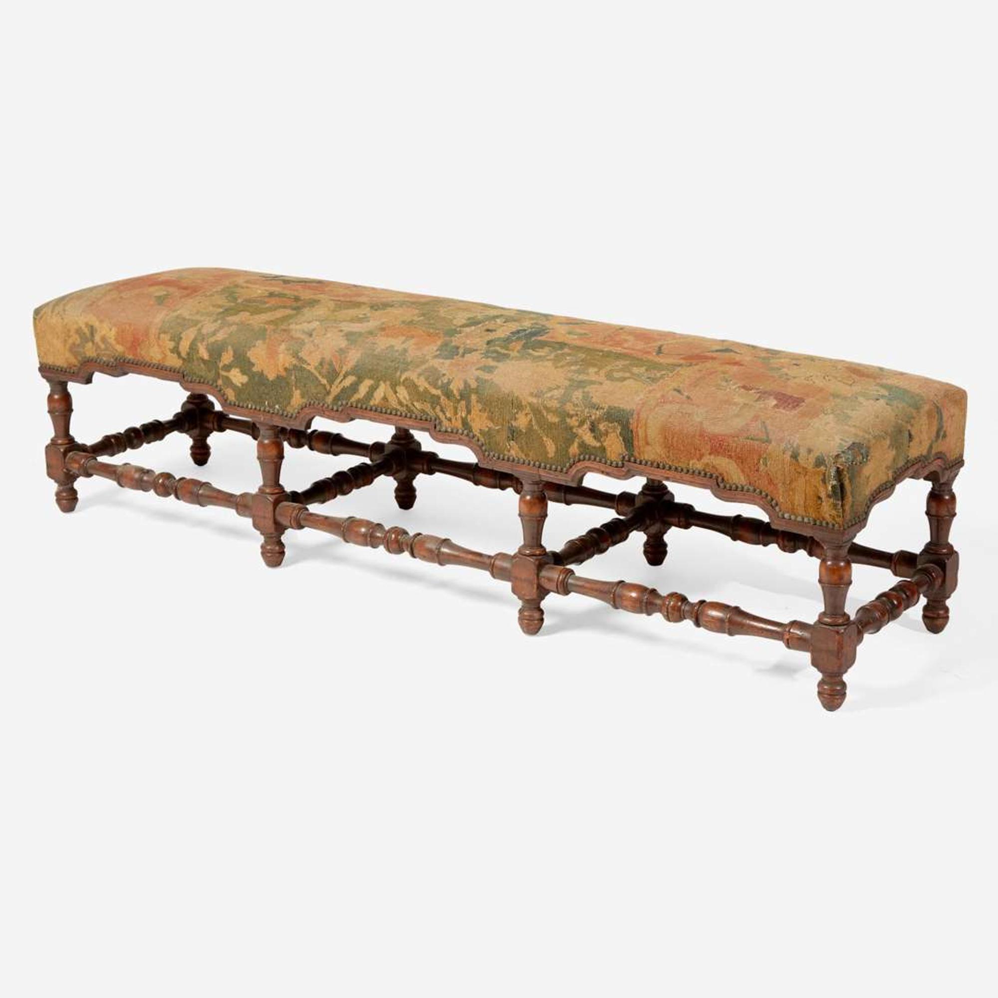 A Baroque Revival carved walnut bench with kilim upholstery late 19th / early 20th century