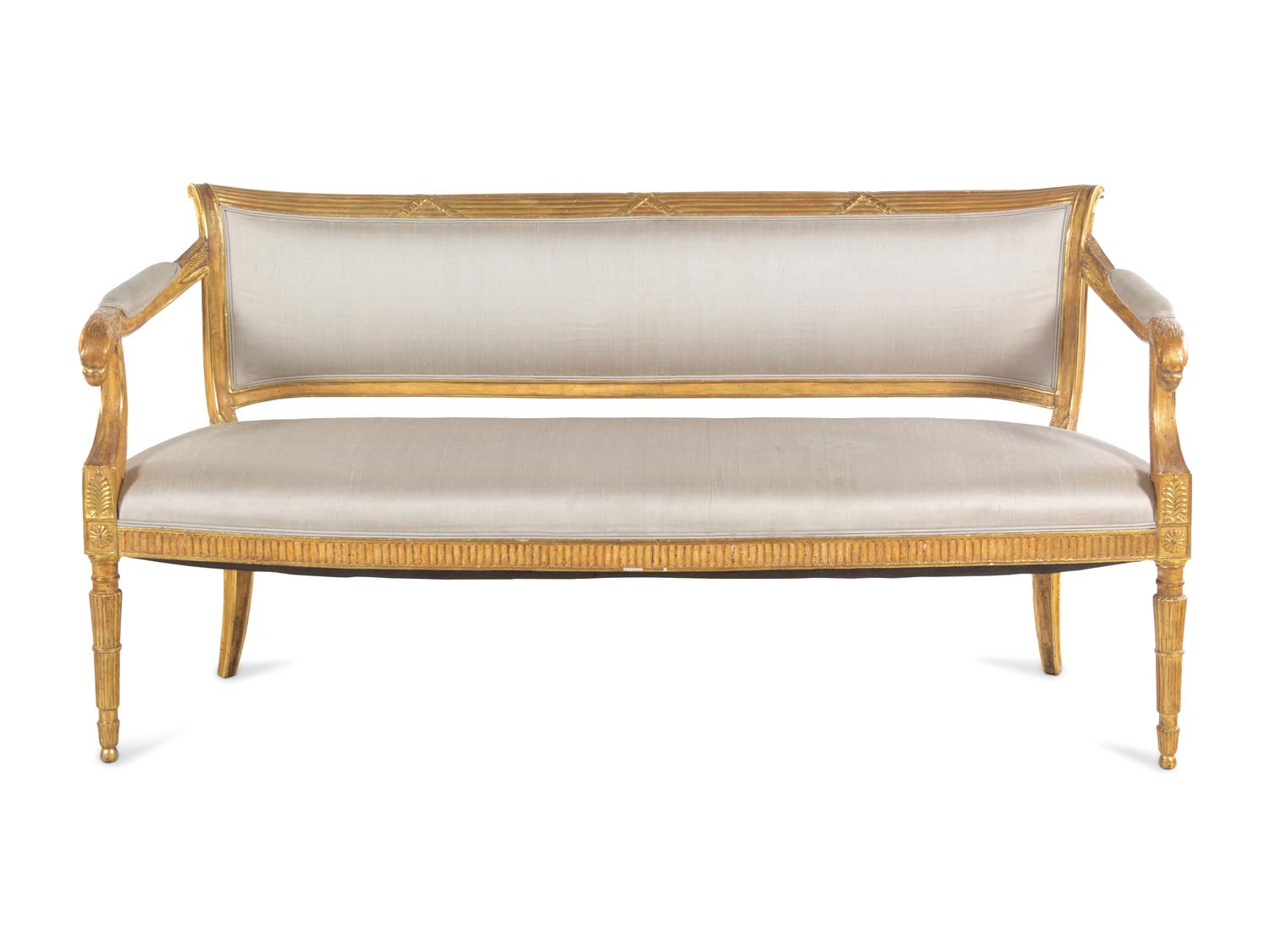A Pair of Northern Italian Giltwood Sofas with Griffin Supports