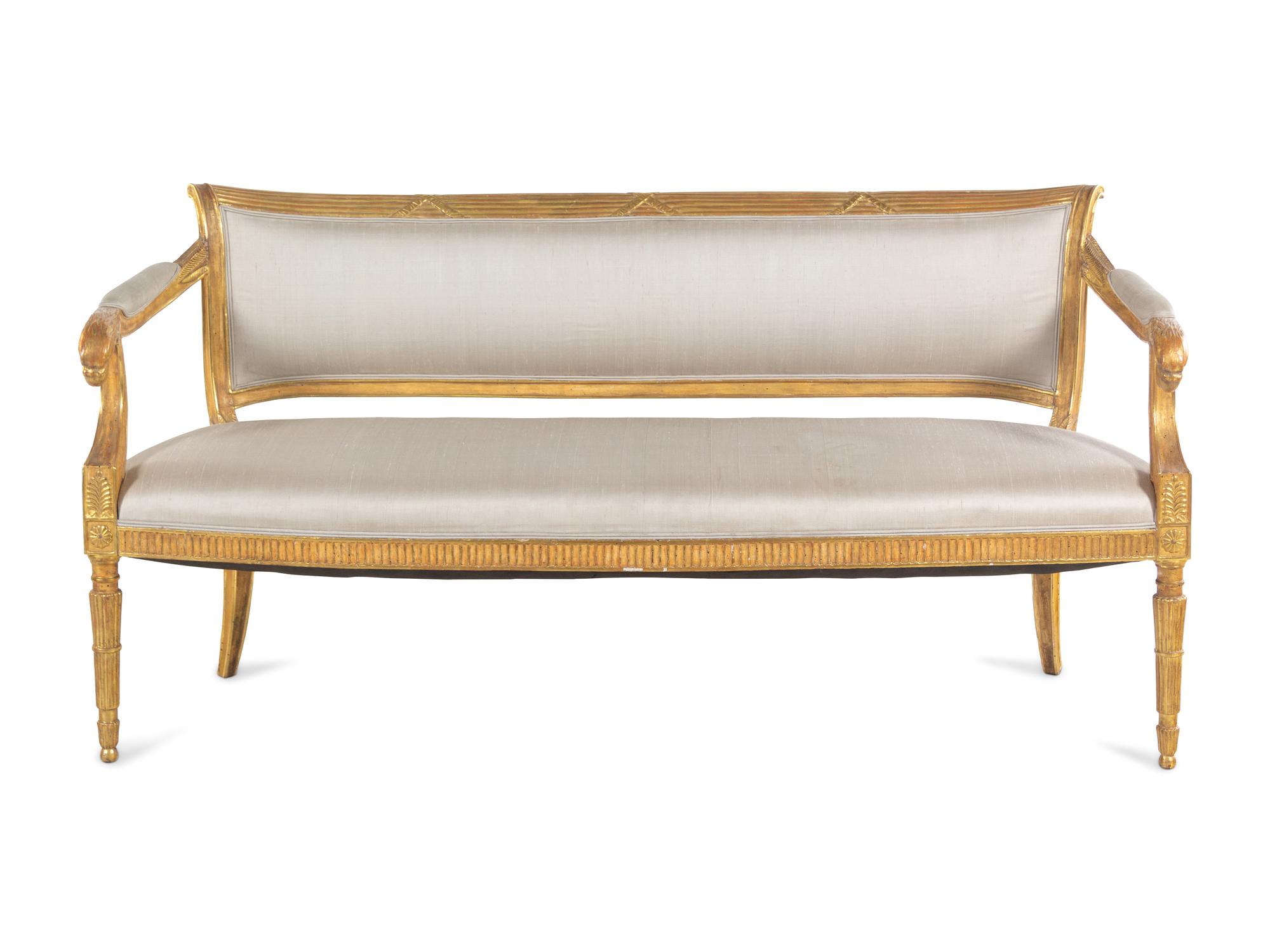 A Pair of Northern Italian Giltwood Sofas with Griffin Supports