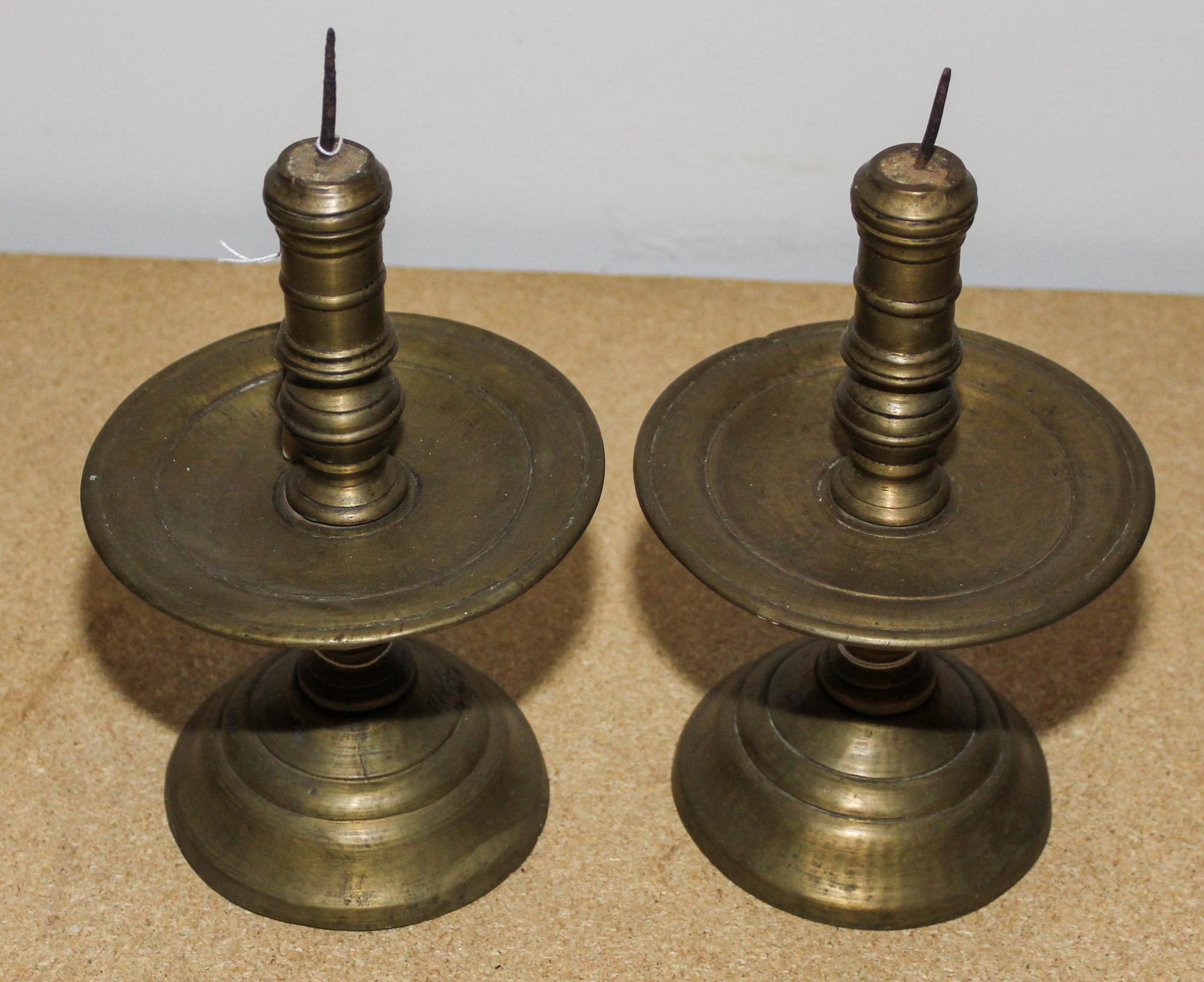 A Pair of Continental Brass Candlesticks Height 9 1/2 inches. — 17TH/18TH CENTURY