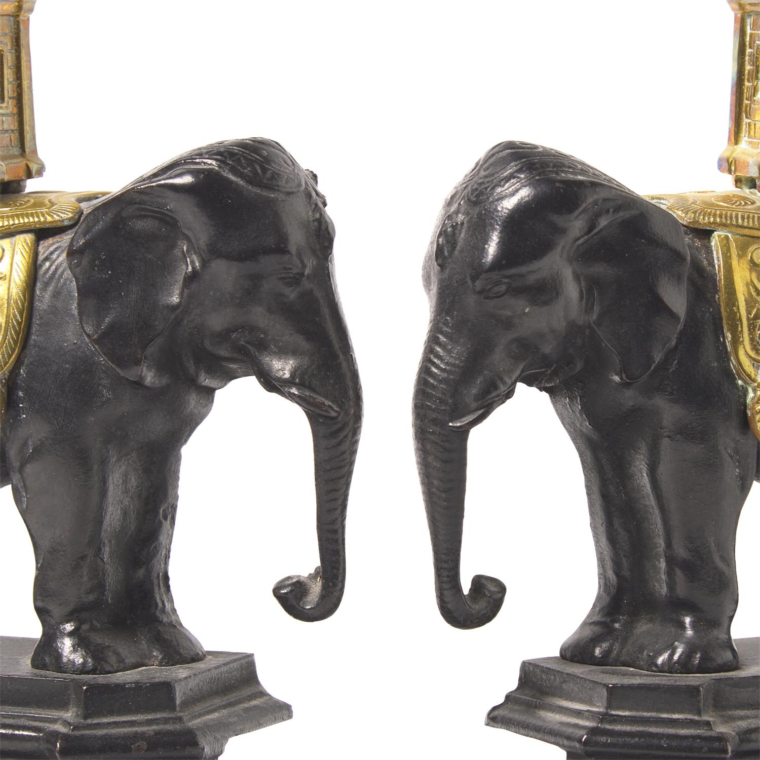 A Pair of French Patinated and Gilt Bronze Elephant-Form Chenets