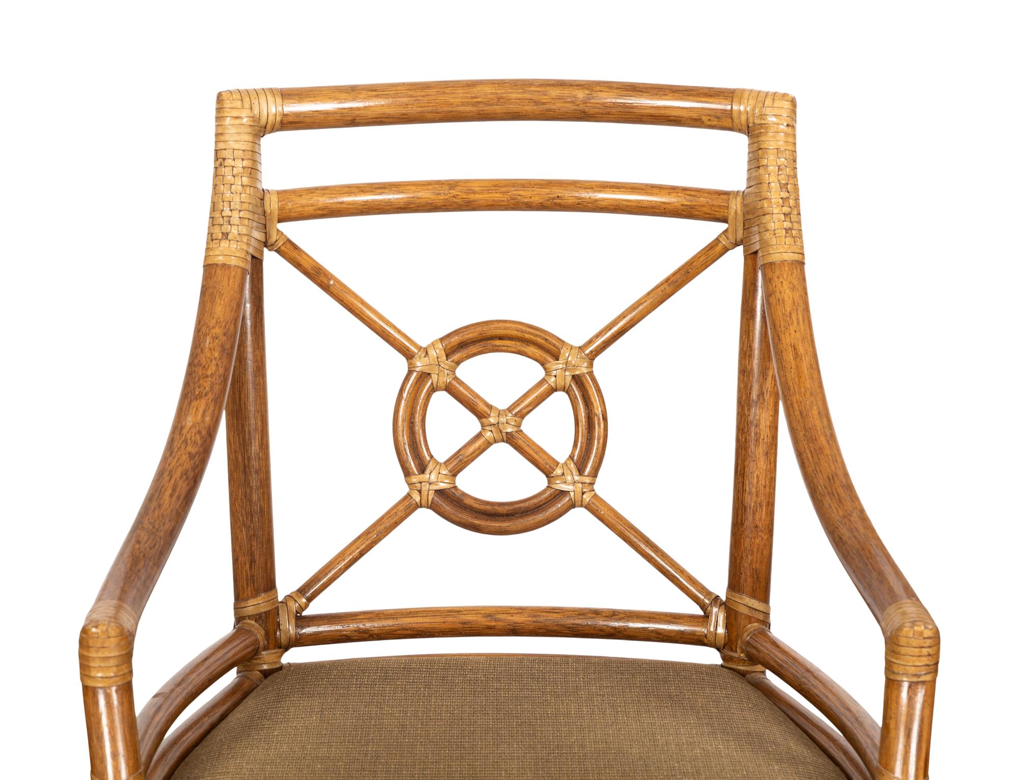 A Set of Four McGuire Rattan Target Armchairs and an Organic Bamboo Table