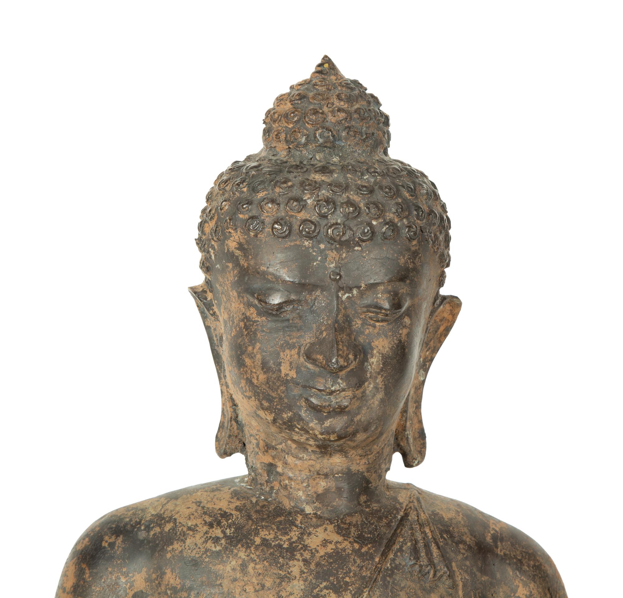 A Patinated Bronze Seated Buddha