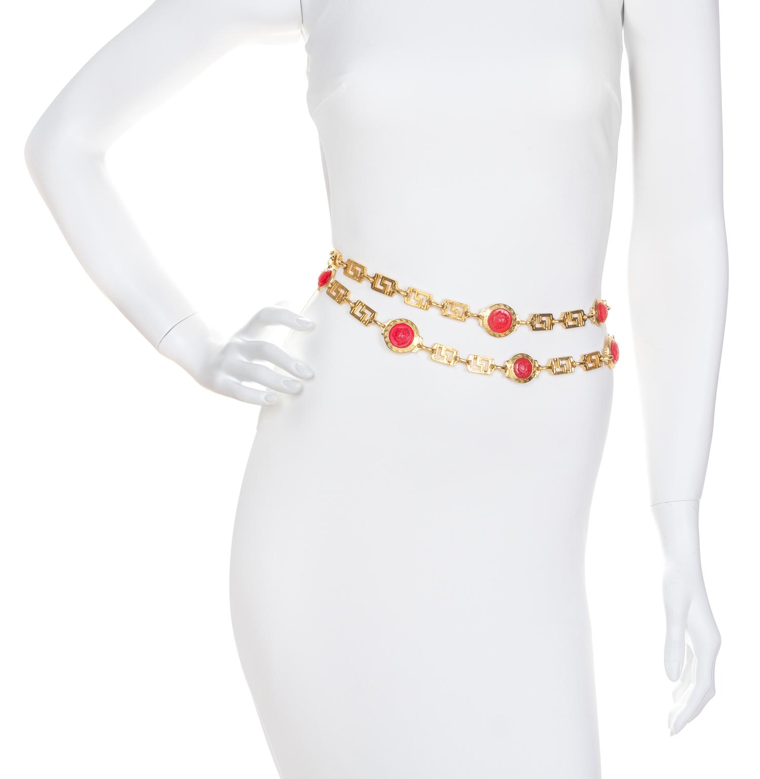 A Gianni Versace Red Embossed Medusa Medallion and Greco Link Belt,