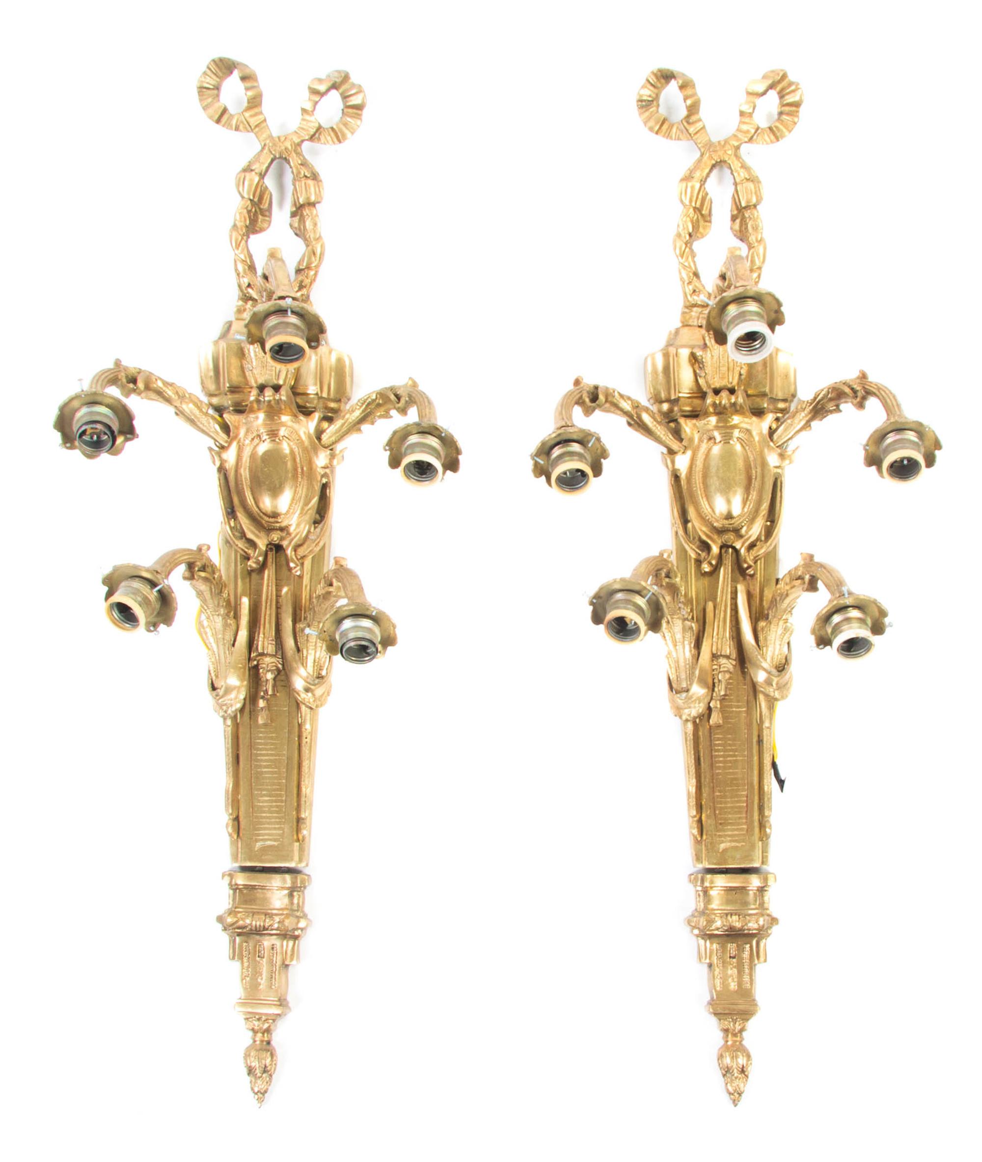 A Pair of Louis XVI Style Gilt Bronze Five-Light Sconces, Height 37 inches.