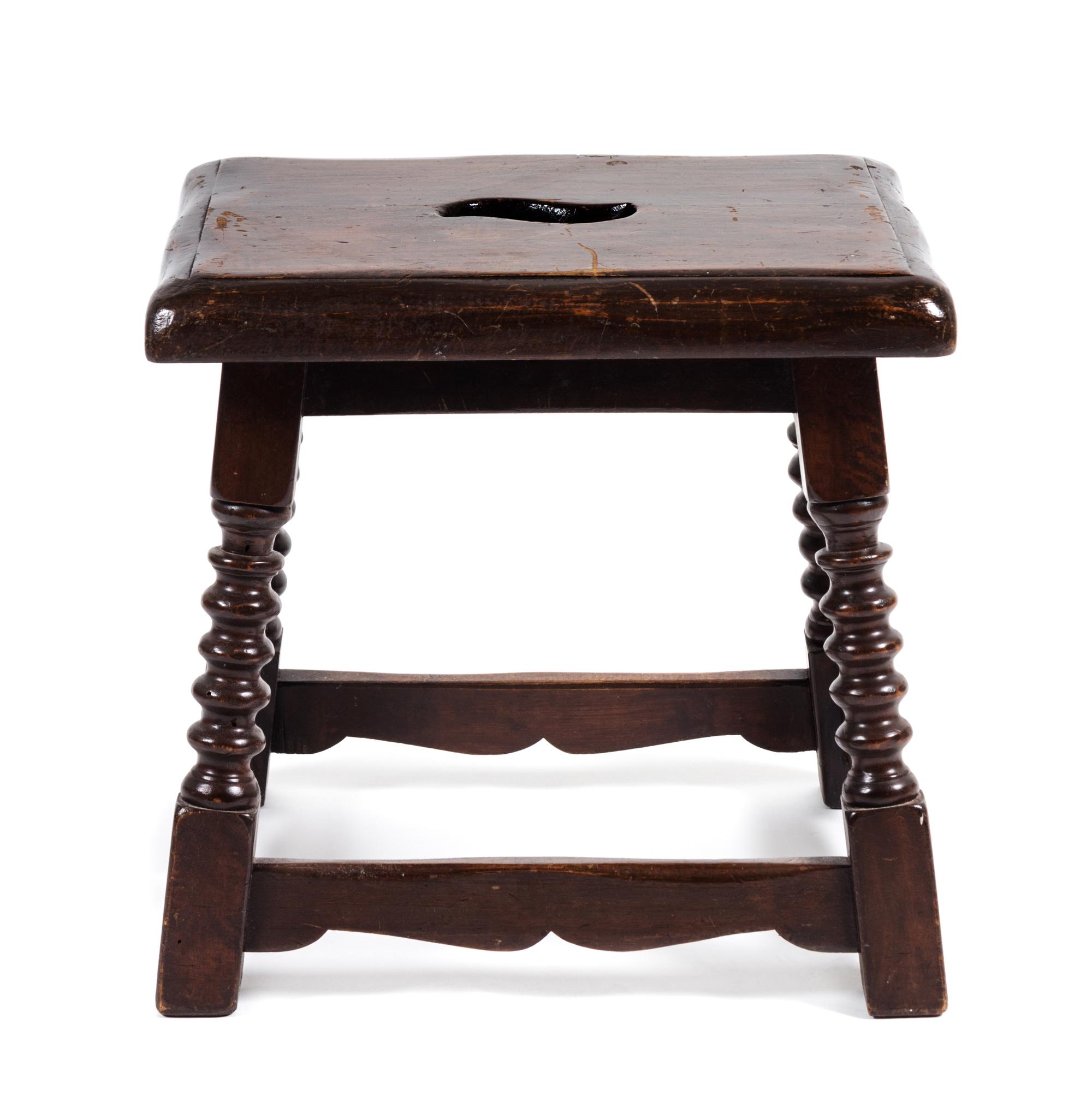 A Jacobean Style Oak Stool Height 17 x width 17 1/2 x depth 14 inches.
