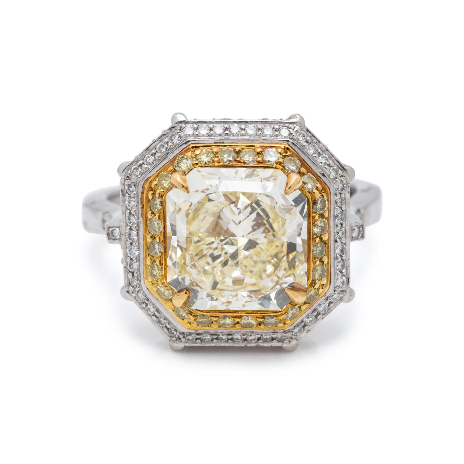 FANCY LIGHT YELLOW DIAMOND AND DIAMOND RING