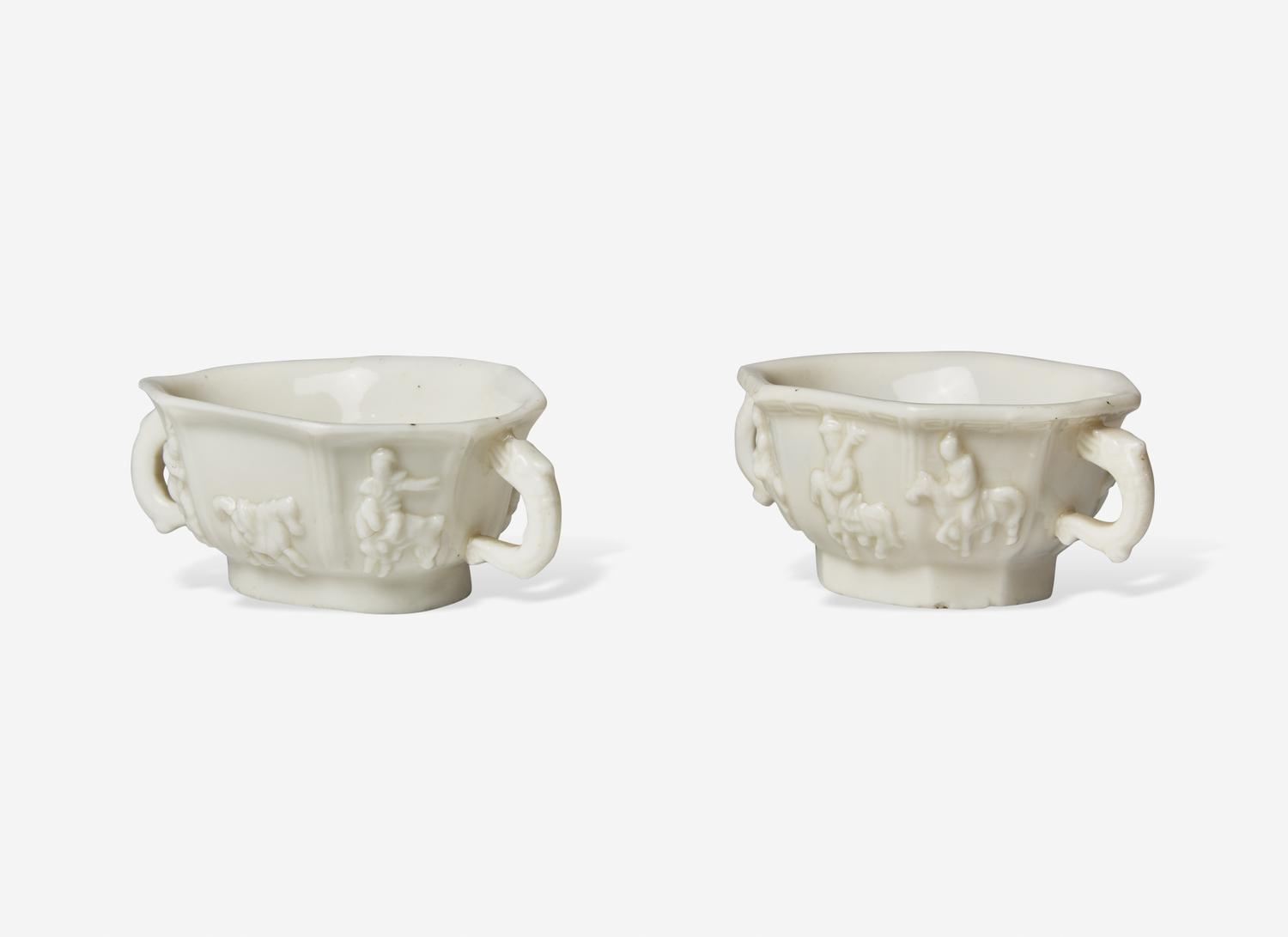 Two Similar Chinese Dehua Porcelain Twin Handled Cups