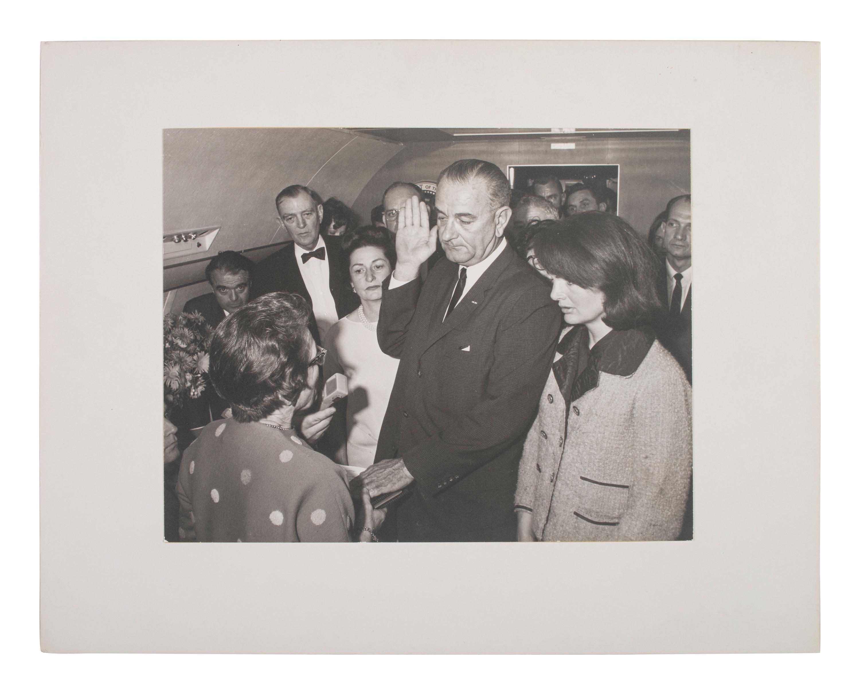 [POLITICS]. STOUGHTON, Cecil (1920-2008), photographer. Photograph of Lyndon B. Johnson's swearing-in aboard Air Force One.