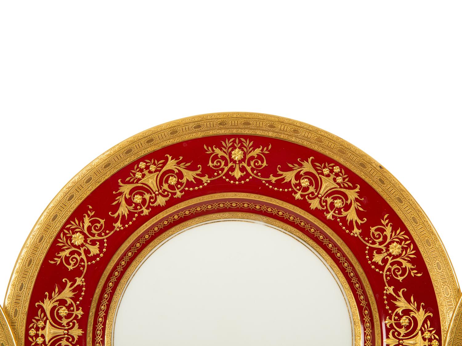 A Set of Twelve Mintons Gilt-Decorated Ruby-Ground Porcelain Dinner Plates