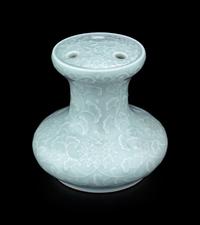 A Pale Celadon Glazed Molded Flower Pot