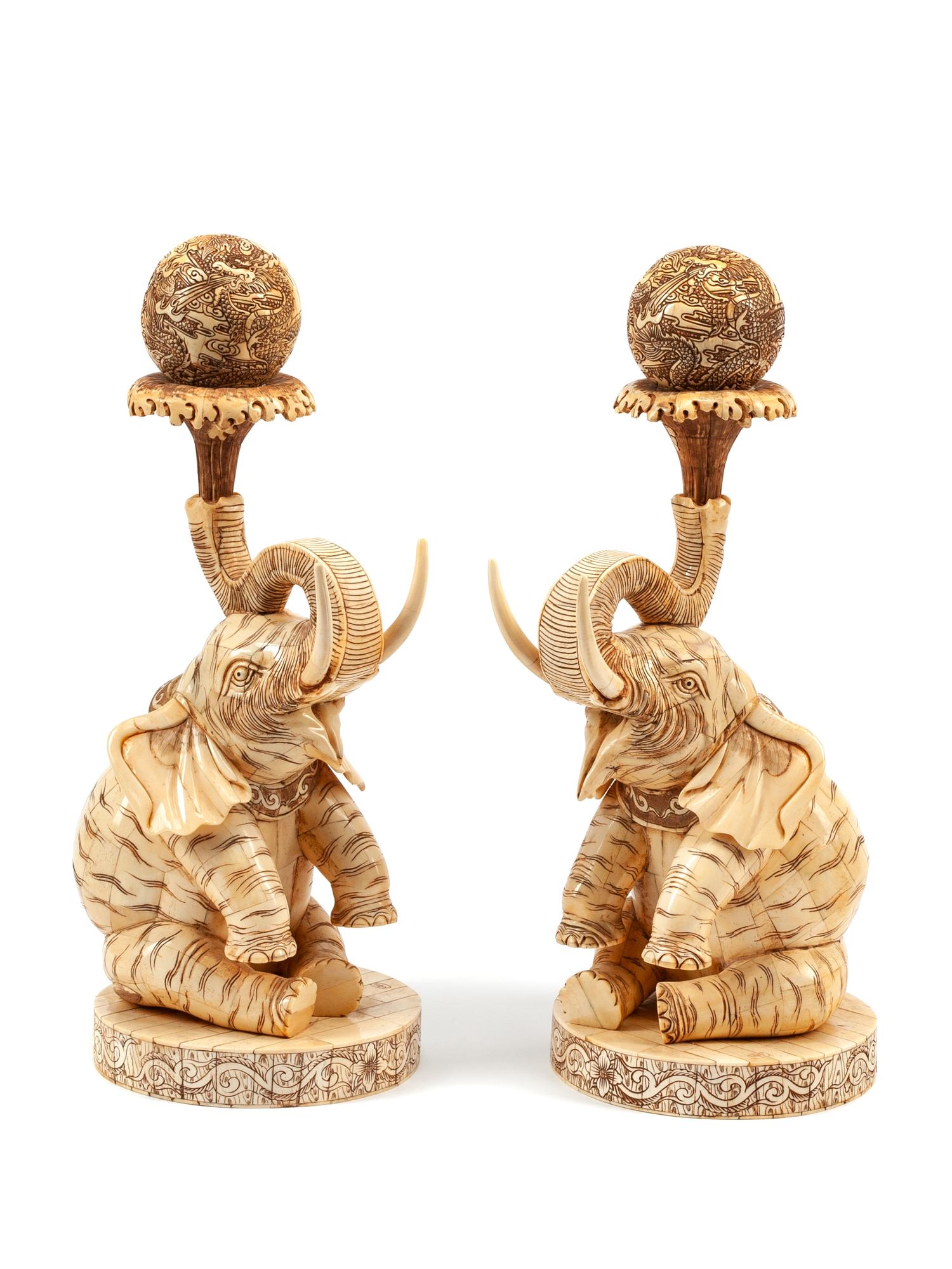 A Pair of Chinese Carved and Enameled Bone Elephants