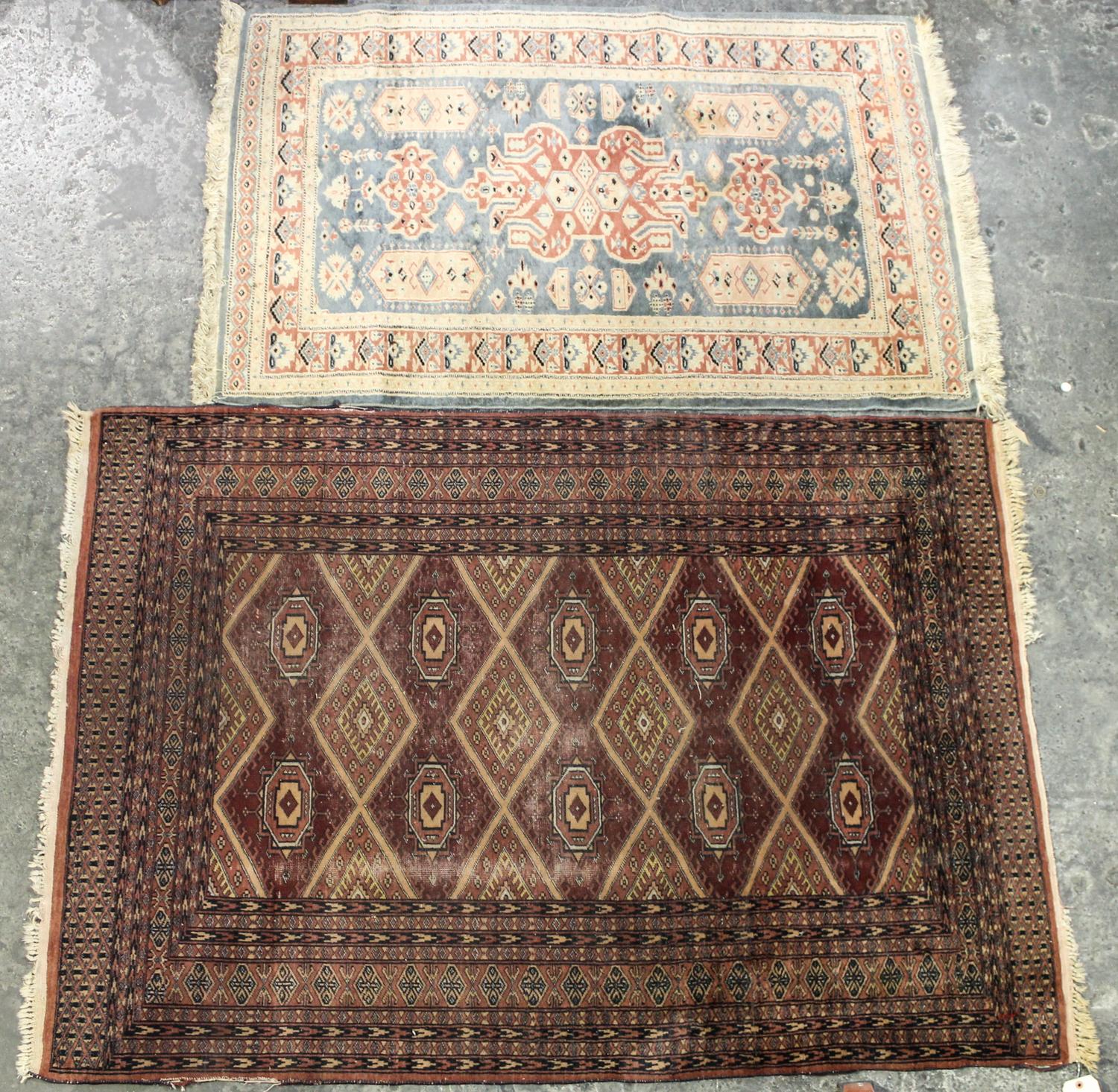 Two Persian Style Wool Mats Larger: 5 feet 9 inches x 4 feet 1 inch.