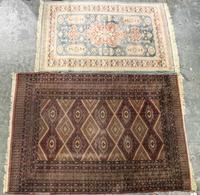 Two Persian Style Wool Mats Larger: 5 feet 9 inches x 4 feet 1 inch.
