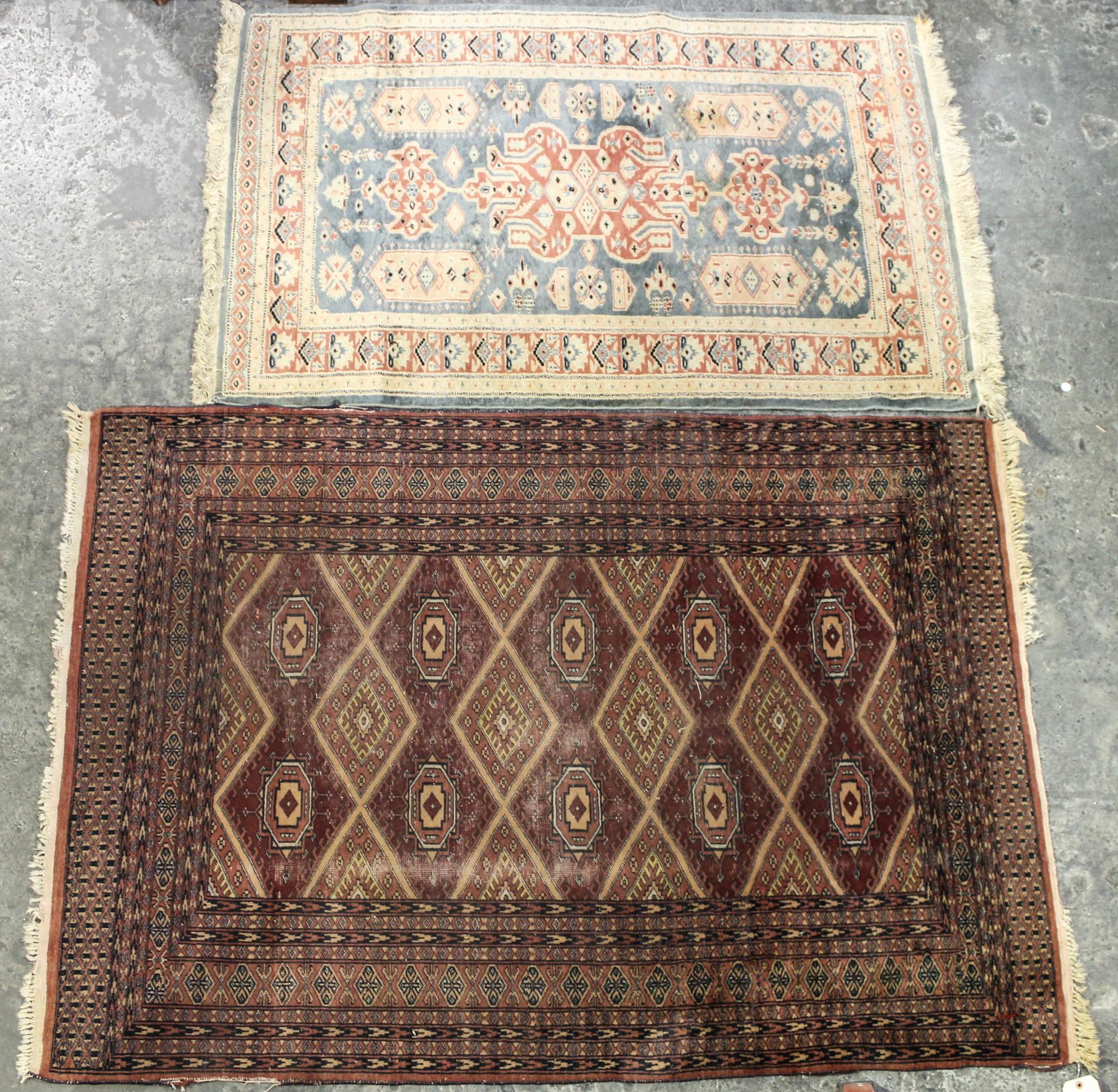 Two Persian Style Wool Mats Larger: 5 feet 9 inches x 4 feet 1 inch.