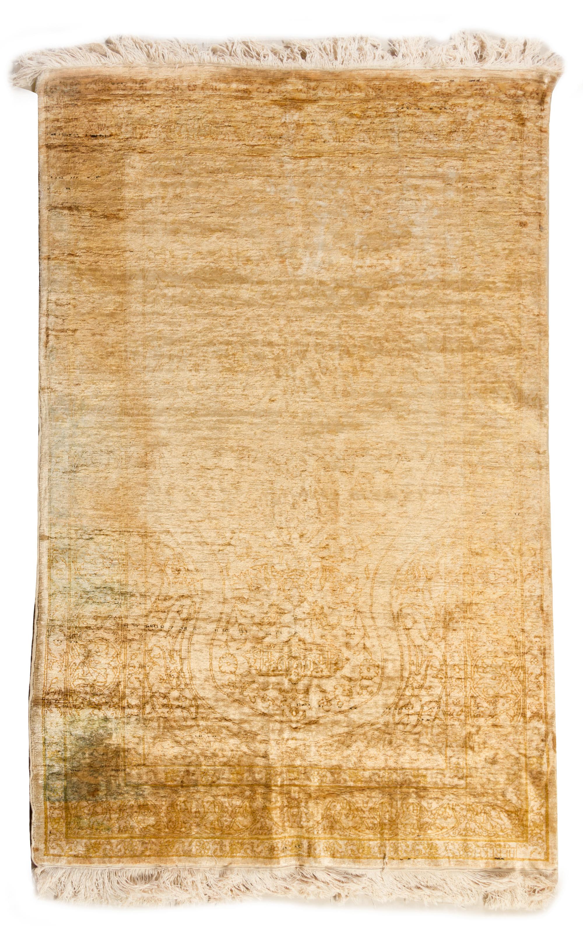 A Silk Rug 5 feet 2 1/2 inches x 3 feet 3 1/2 inches.