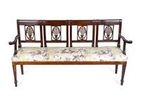 An Italian Neoclassical Carved Mahogany Quadruple Chairback Settee — 19TH CENTURY