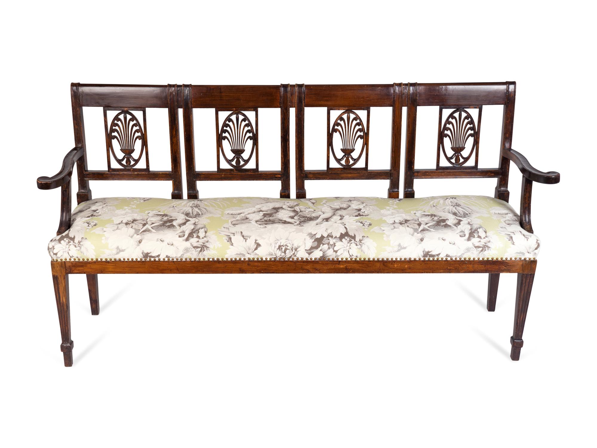 An Italian Neoclassical Carved Mahogany Quadruple Chairback Settee — 19TH CENTURY